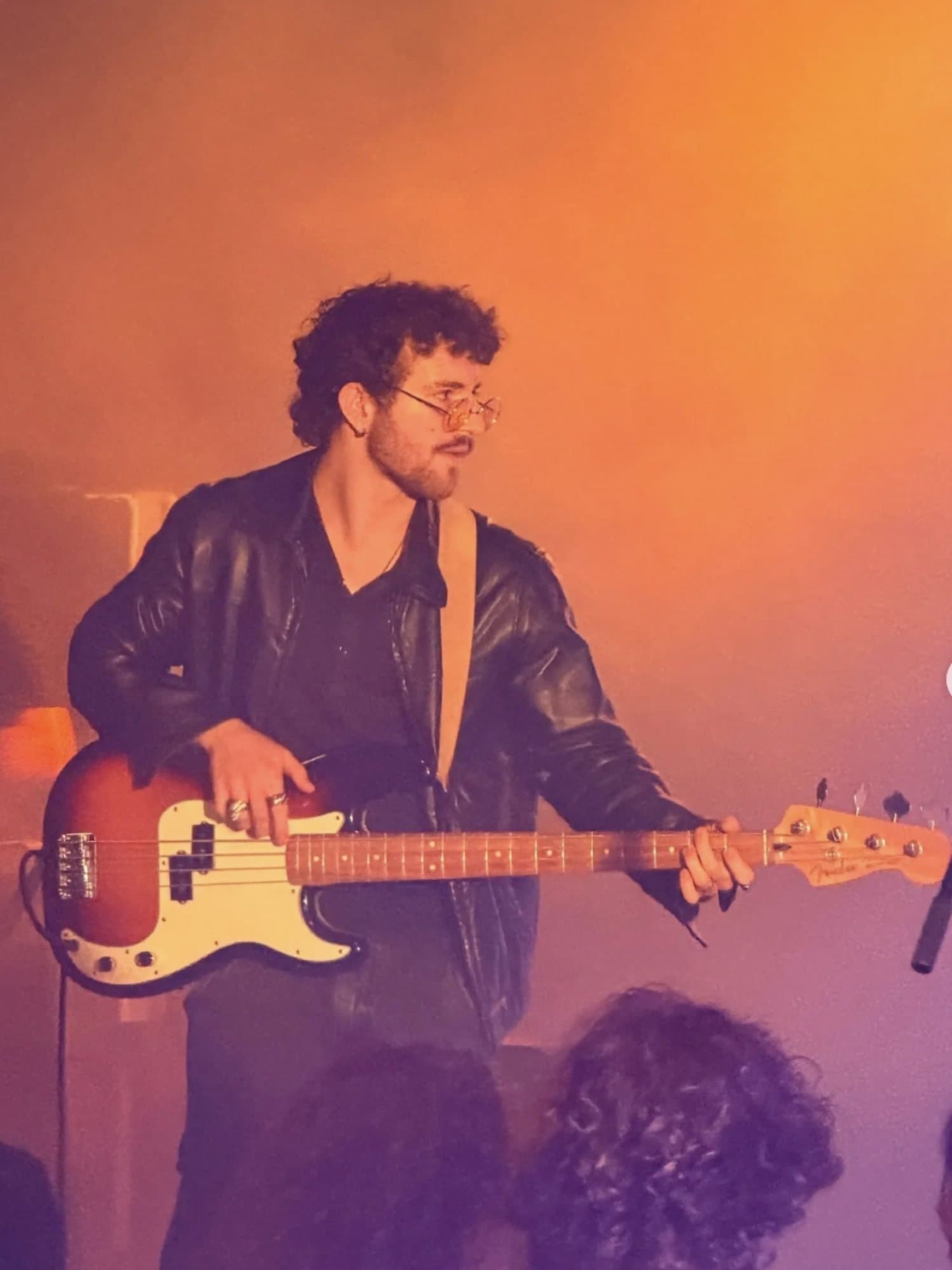 AJ DeAugustine playing bass on stage