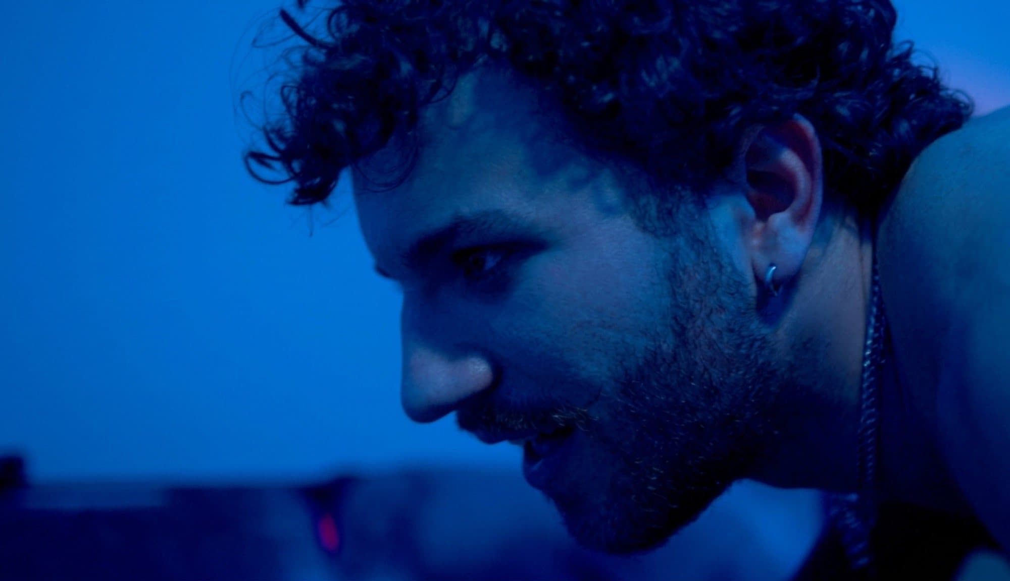 AJ DeAugustine in blue light in Soul Mates